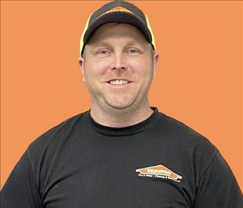 man in front of orange background