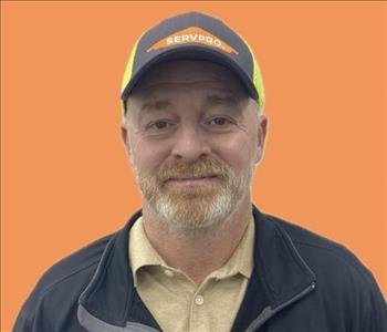 man in front of orange background