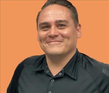 man in front of orange background