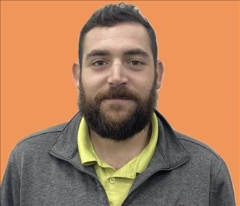 man in front of orange background