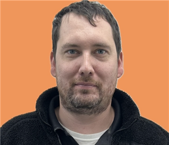 man in front of orange background