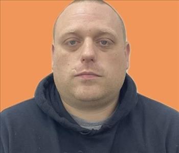 man in front of orange background