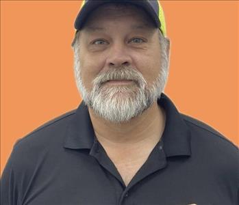 man in front of orange background