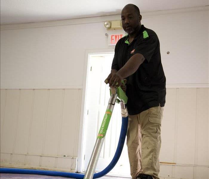 A SERVPRO technician working on assessing damage. 